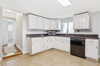 View into laundry area, full bath & bedroom