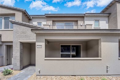 Doorway to property with a balcony and stucco sidi