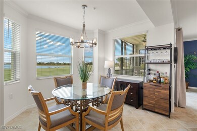 Dining area featuring light tile patterned floors,