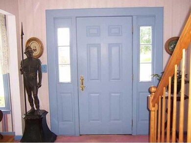 Foyer. Welcoming foyer with traditional 6-panel fr