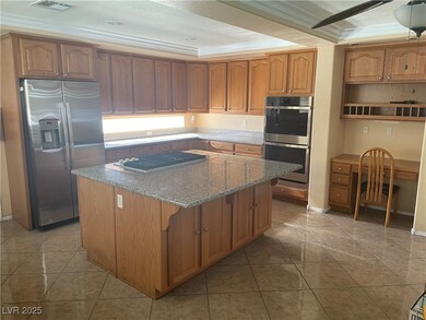 Kitchen with stainless steel appliances, a center