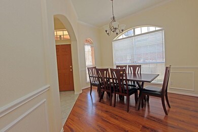 Dining Room with laminate flooring, high ceilings,