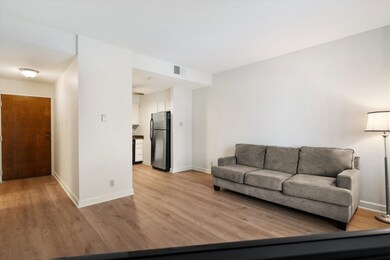 Living room with light wood-type flooring