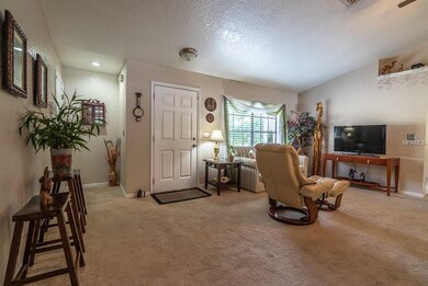 Living area towards front door. Garage entrance af