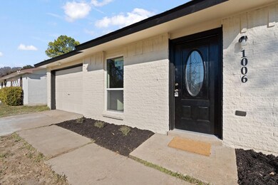 View of exterior entry with a garage