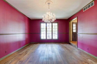 A large window lets lots of light into the dining 