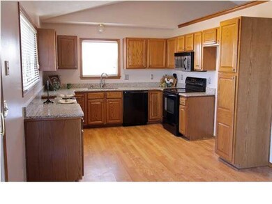 BEAUTIFUL GRANITE COUNTERTOPS AND OPEN KITCHEN WIT