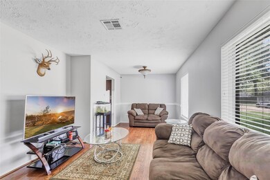 This cozy living room features bright natural ligh