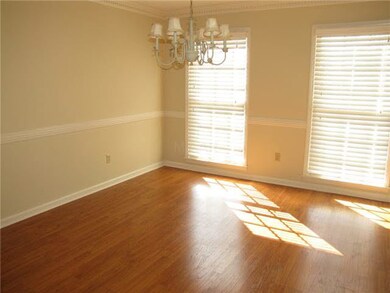 The formal dining room is just off the foyer and o
