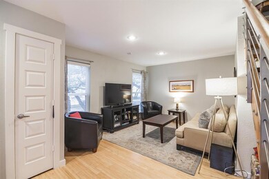 Living area featuring wood finished floors and re
