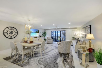 Dining room with a chandelier and recessed lighting