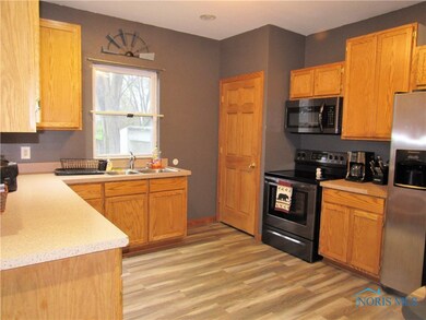 Plenty of cabinets, counterspace, newer laminate f