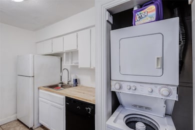 Washroom featuring light tile patterned floors, st