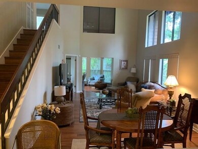 Dining/living area, enclosed porch, stairs to 2nd