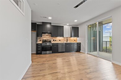 Kitchen featuring appliances with stainless steel