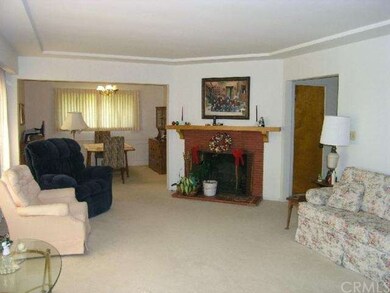 Light, spacious living room looking toward dining 
