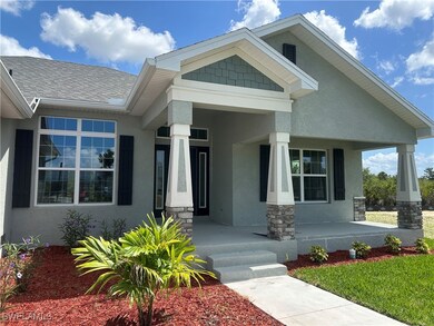 View of front of property with covered porch, stuc