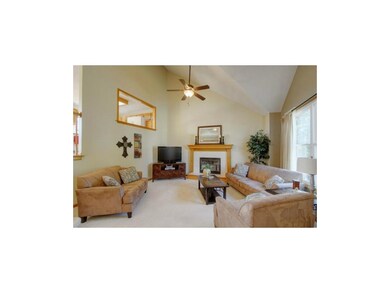 Family Room with Vaulted Ceilings & Charming Firep
