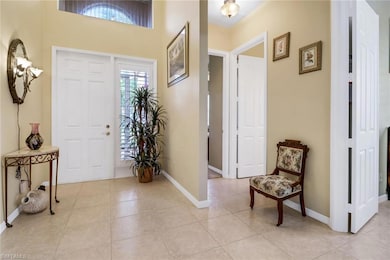 Foyer entrance featuring light tile patterned floo