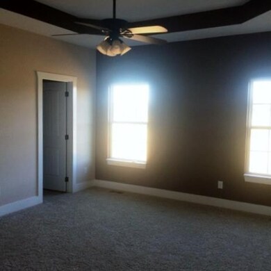 Huge master suite with his and her closets and a g