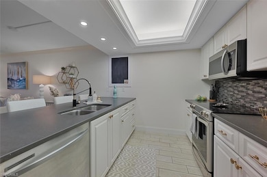 Kitchen featuring sink, appliances with stainless 