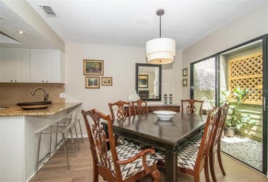 Dining room, open to kitchen and living. Atrium on