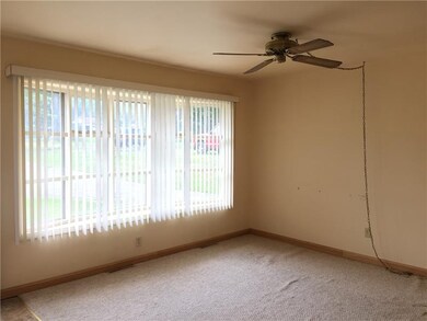 living room has large bay window and open to the k