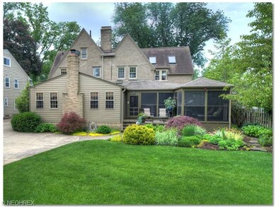 Landscaped yard with large screened in porch