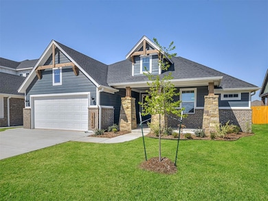 Craftsman inspired home featuring concrete driveway, roof with shingles, a porch, and brick siding