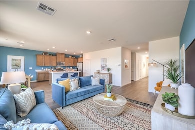 Living room featuring baseboards, visible vents, r