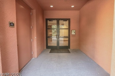 View of exterior entry with stucco siding and fren