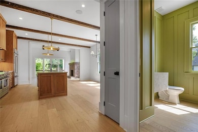 Half bath and linen closet adjoin the spacious kit