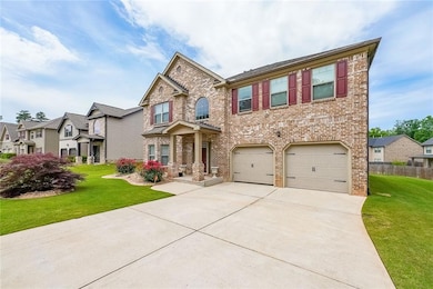 View of front of home featuring brick siding, conc