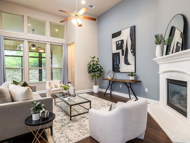 Living room featuring baseboards, visible vents, 