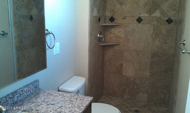 Travertine Showers and Granite Vanitys