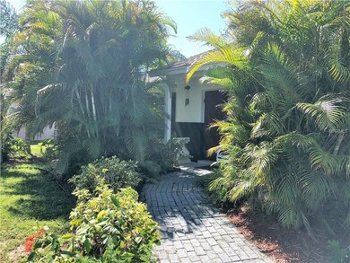 An inviting brick walk to the front door.