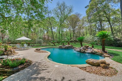 Resort style back yard space complete with rock waterfall.