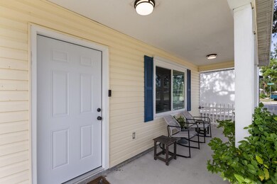 Covered front porch - great place to greet your guests  - new impact front door