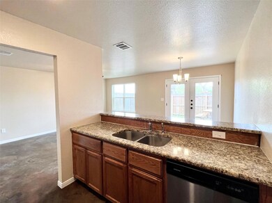 Kitchen with stainless steel dishwasher, pendant 