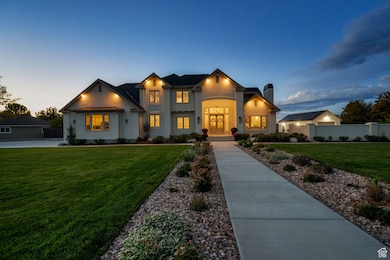 View of front of home with a chimney and stucco siding
