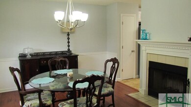 Formal dining room with wood burning fireplace and