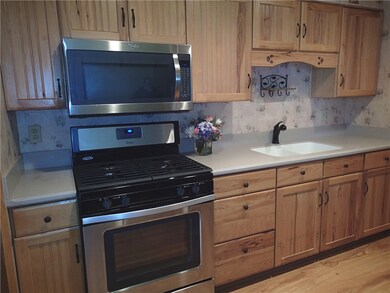 Cozy step saver kitchen with Pantry, refrigerator,