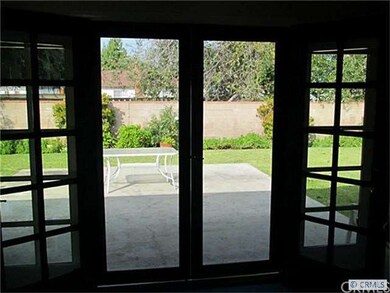 French doors and windows opening up to the backyar