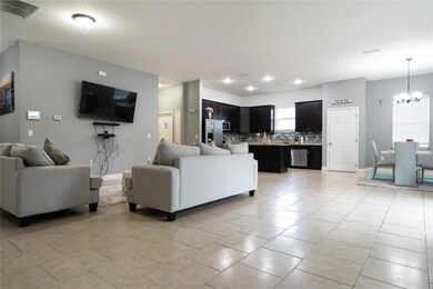Main living area. Bedrooms #2 & #3 between TV and kitchen.