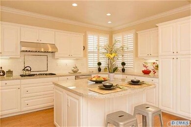 Alternate view of kitchen  from Dining area  highl