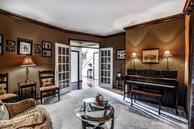 French doors frame the entrance to the living room
