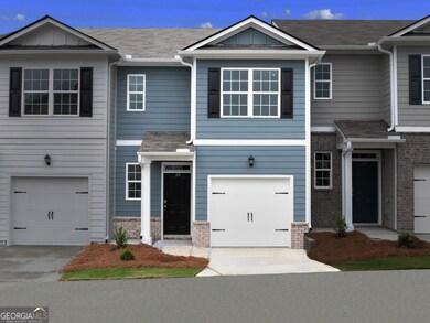 Pearson townhome exterior with blue color vinyl an