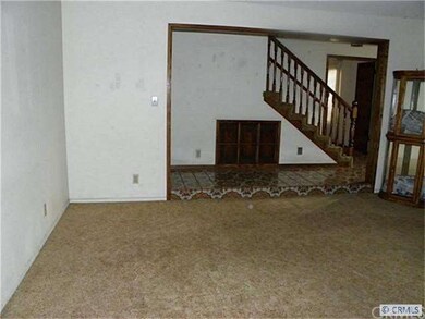 Formal Living room looking out to the foyer.