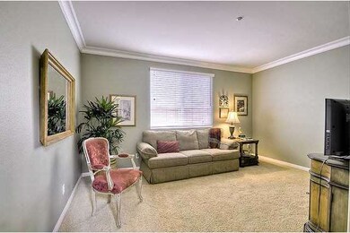 The first floor office/den features crown molding,