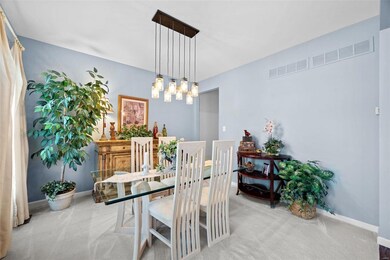 Formal Dining Room with newer light fixture.